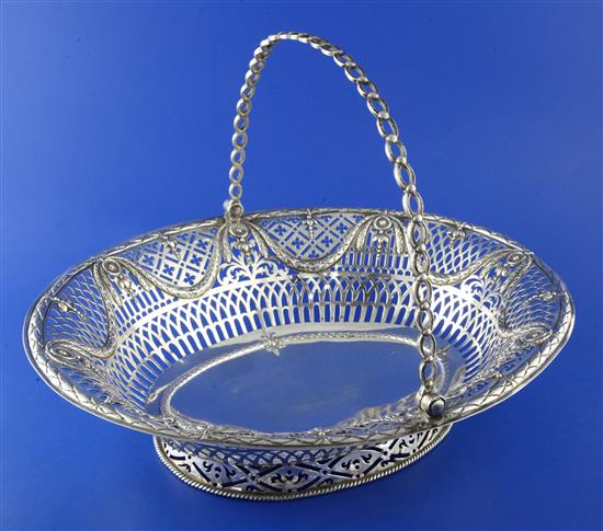 A George III pierced silver oval cake basket by William Plummer, 19.5 oz.
